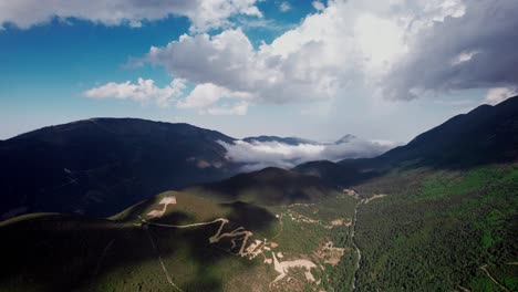 Beautiful-dirt-road-winding-through-mountains