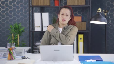 tired business woman with aching shoulders.
