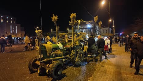 traditional scary-looking tractor and chariot decorated with reeds and hay straws for banish winter purposes at the busó-walking festival in mohacs, hungary.