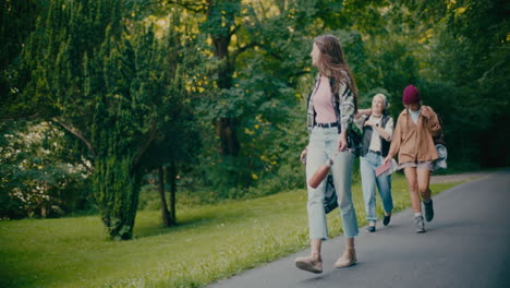 carefree female friends enjoying in forest