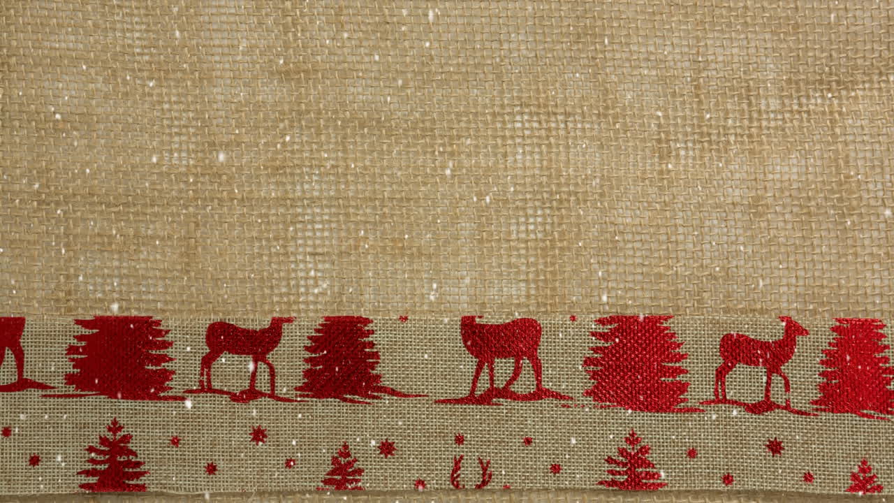la nieve cayendo con el textil de renos de navidad