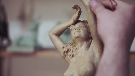 sculpting a clay figure