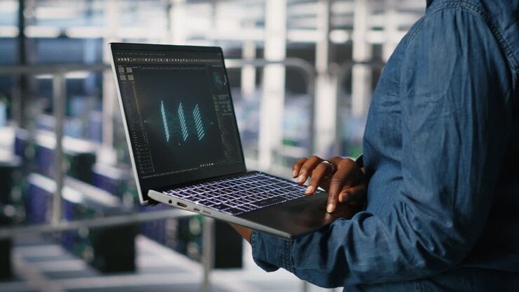 Close up of admin using laptop to monitor neural network LLM visualization