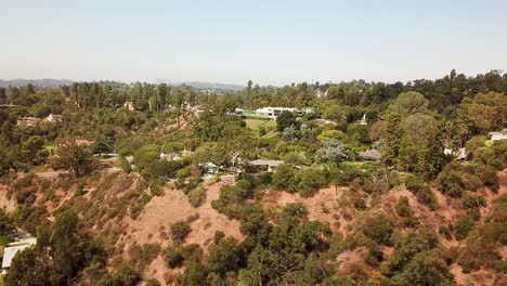aerial wide shot of luxury villas and mansion on hill of angeles national forest. pasadena city, california. expensive mansions with beautiful view on los angeles