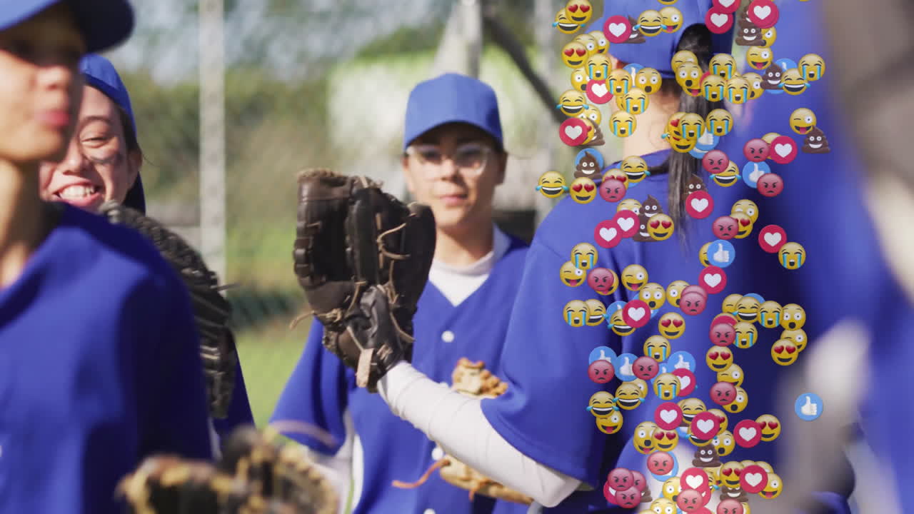 Female softball players posing on field, showing heart icon emoji overlay for sports marketing