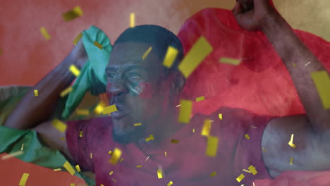 animation of gold confetti over cheering african american male sports fan waving flag of portugal
