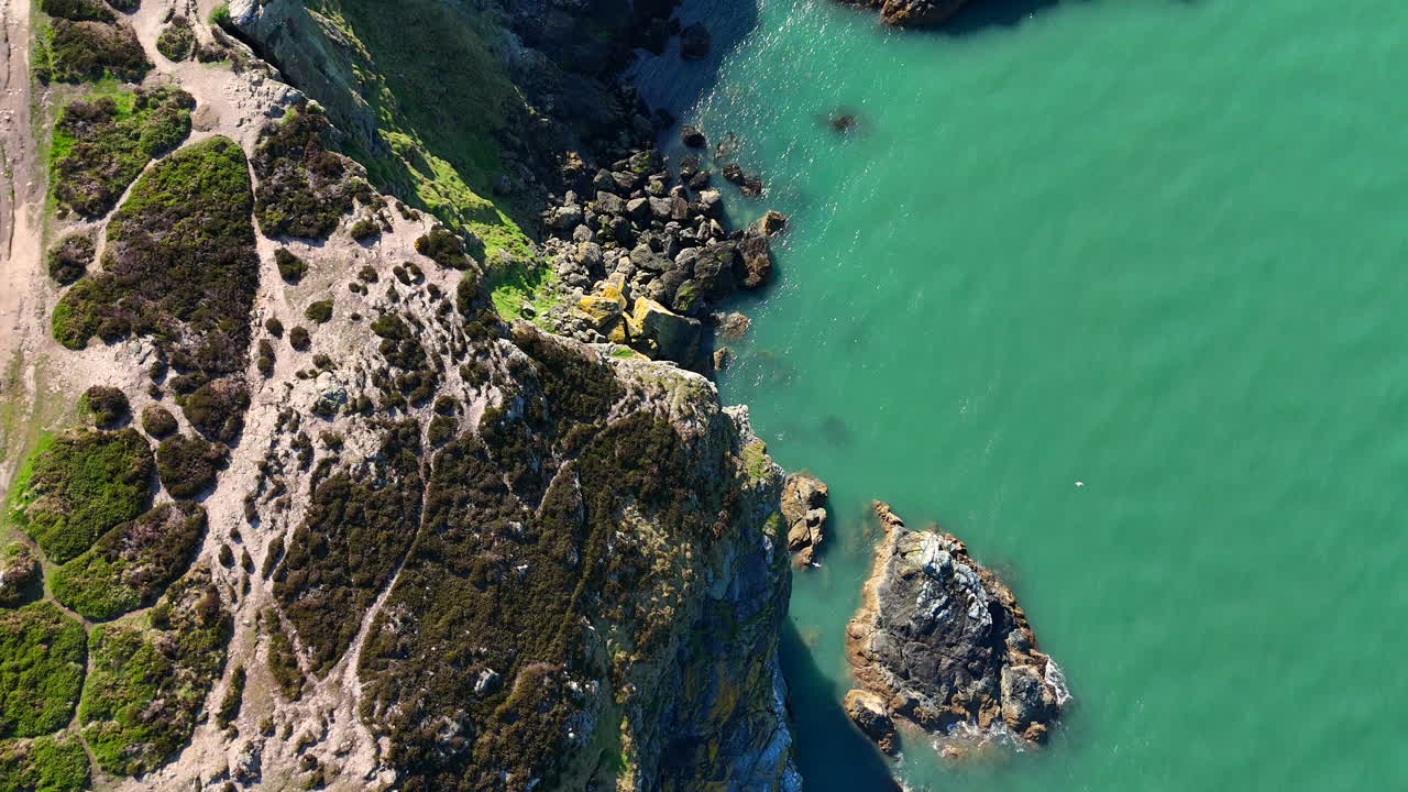 Aerial views of Irish coastline cliffs during summers day