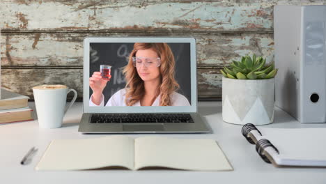 animation of a laptop showing a caucasian female scientist wearing protective goggles