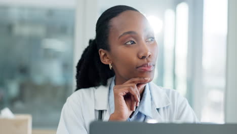 Doctor,-thinking-and-woman-with-research-on-laptop