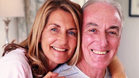 Happy-senior-couple-interacting-with-each-other-on-bed