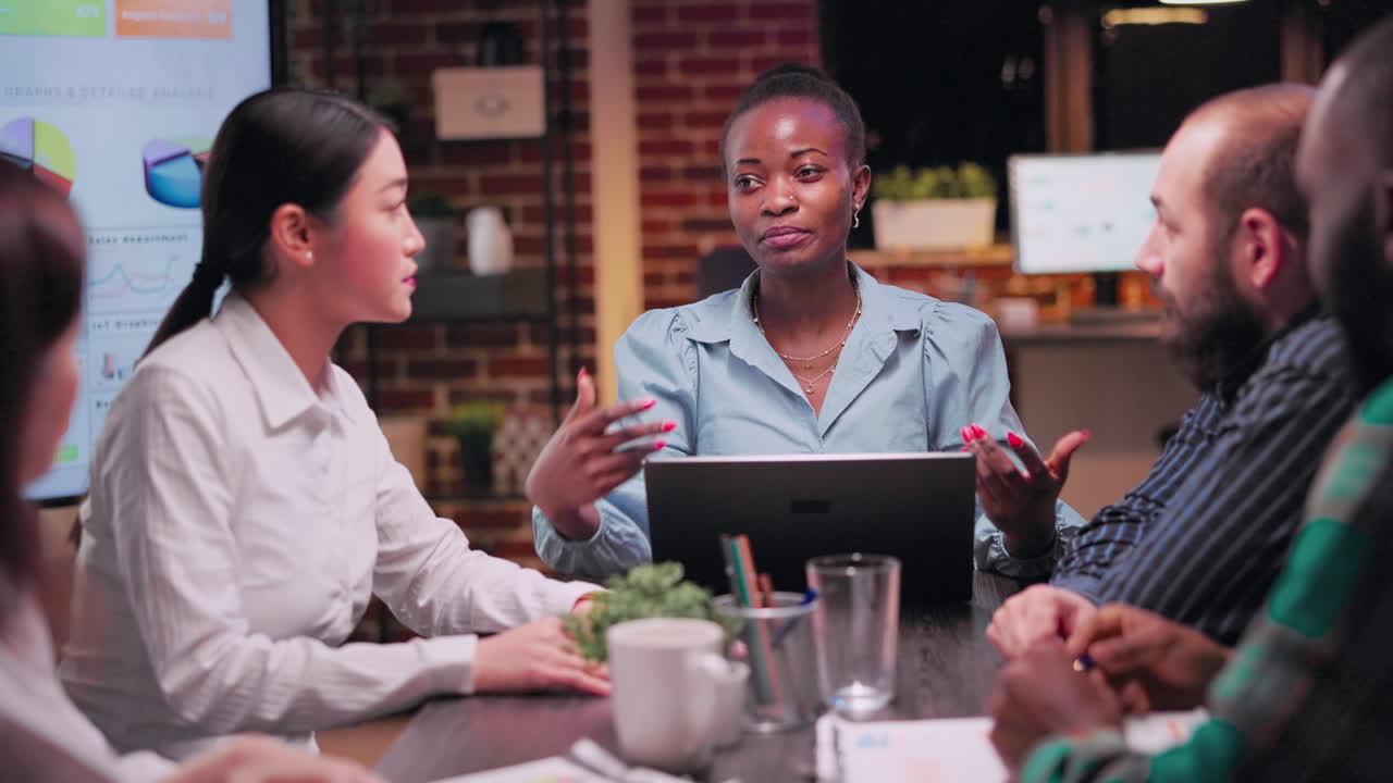 Company strategic planning business meeting, team lead speaking