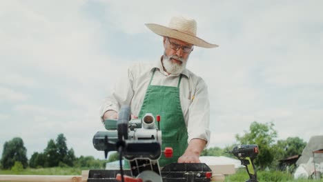 senior carpenter working with wood