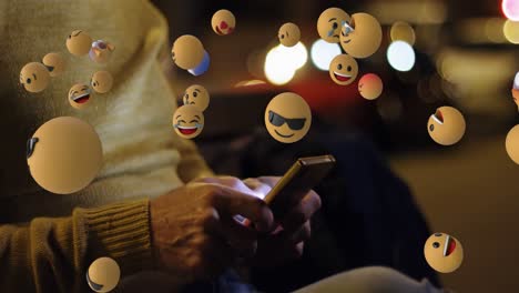 emoji icons with a man using smartphone in the background 4k