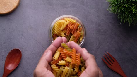 colorful spiral pasta in a glass jar