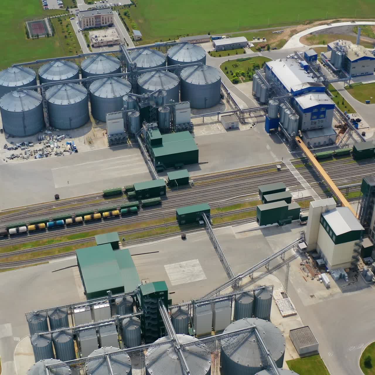 Farm grain silos for agriculture. Aerial view of agricultural silos, grain elevator for storage and drying of cereals