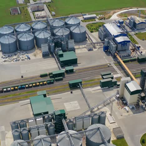 farm grain silos for agriculture. aerial view of agricultural silos, grain elevator for storage and drying of cereals