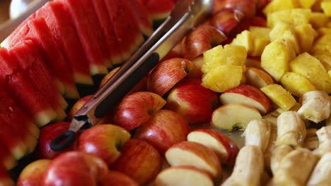 fresh fruit on a colorful platter. apples, bananas, pineapple, watermelon
