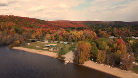 Autumn-Trees-And-Playground-Park-On-The-Lake-Shore-In-Muskoka,-Ontario,-Canada-During-Fall-Season