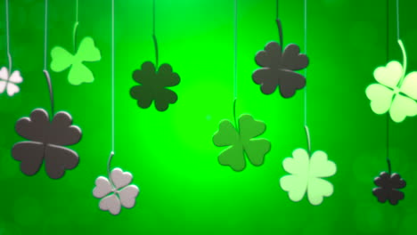 Closeup-hanging-Irish-shamrocks-on-green-gradient