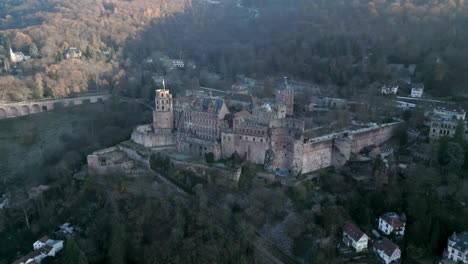 majestic aerial view of the historic heidelberg castle in germany nestled on a mountainside covered in lush trees