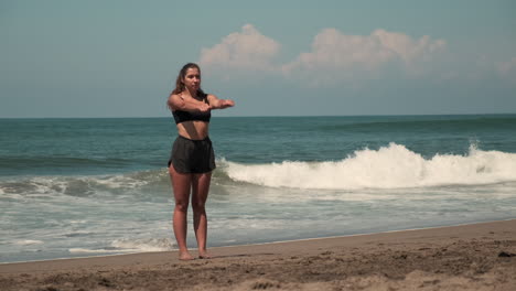 woman exercising on a beach