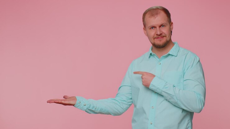 Man pointing empty place advertising area for commercial text copy space for goods promotion