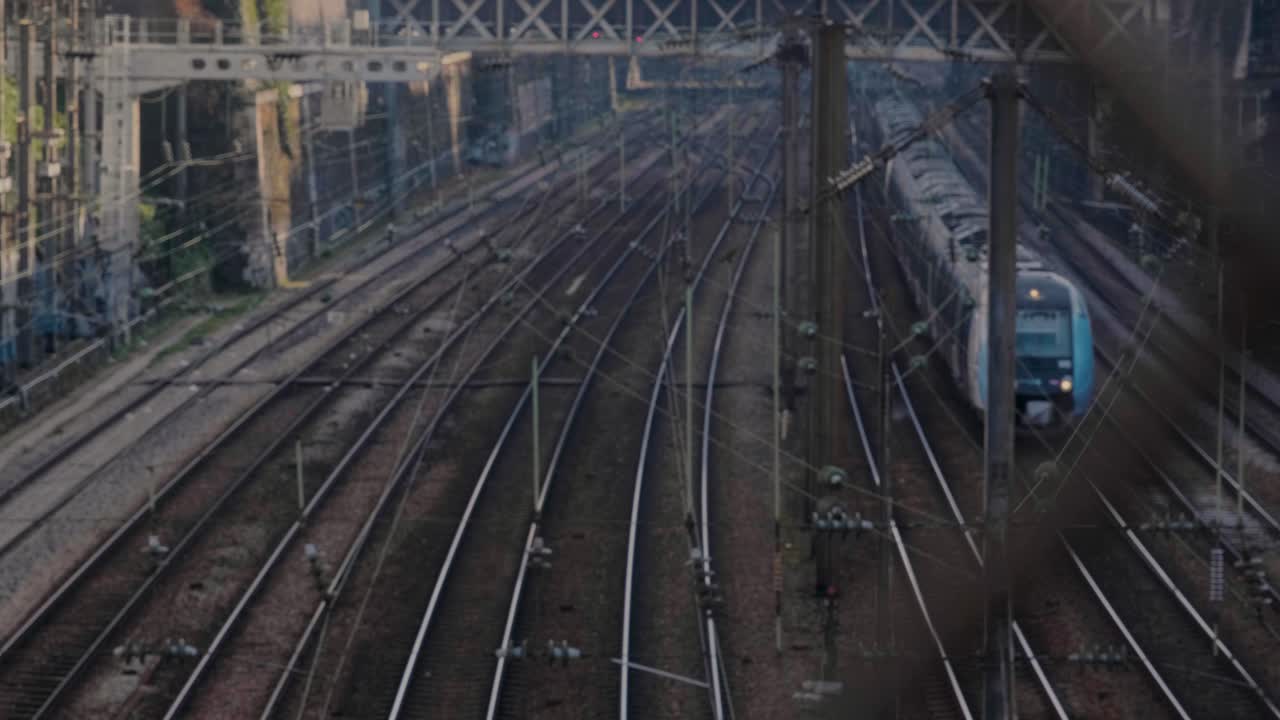 Railway tracks with a moving train in Paris