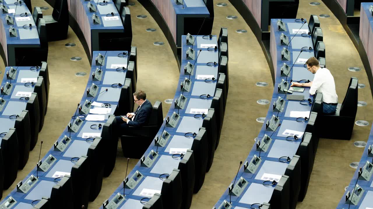 European Parliament members talking before the start of the EU plenary session in Strasbourg, France