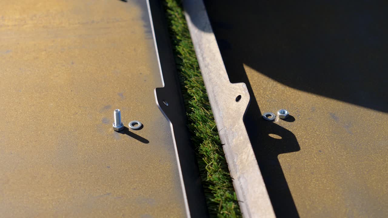 Artificial turf seam detail near concrete surface