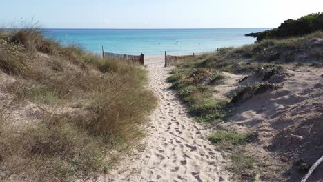 entrance to the beach of cala agulla in majorca