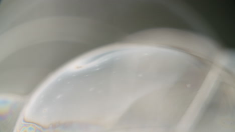 Close-up-of-a-soap-bubble-with-rainbow-colored-surface