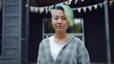 young woman with colorful hair outdoors