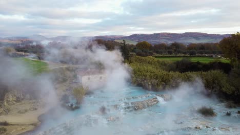 the geothermal hot springs bath and waterfall at saturnia, tuscany italy close to siena and grosseto