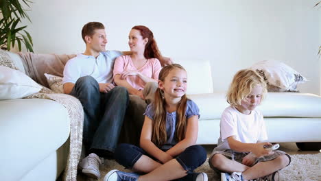 Smiling-family-watching-the-television