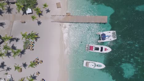 Aerial-View-of-Yacht-And-Catamaran-On-The-Beach-On-Catalina-Island-in-the-Dominican-Republic