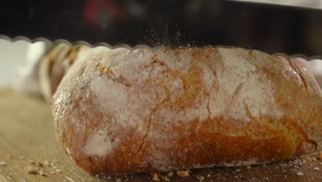 Knife-slices-a-loaf-of-bread