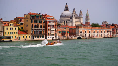 motorboat in speed in the venetian lagoon, venice, italy - pov