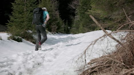 Walking-on-a-hiking-trail-covered-in-deep-snow