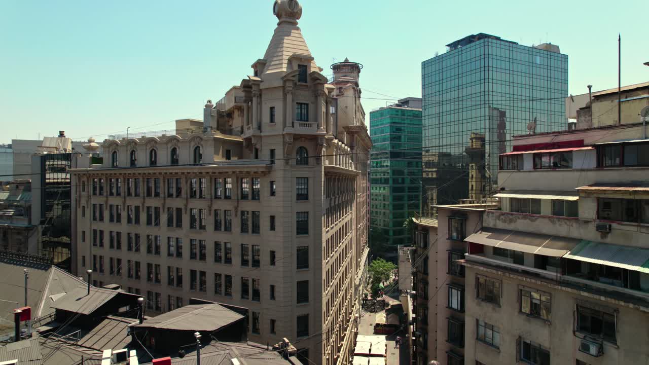 Ascending flyover in La Bolsa neighborhood with the Arizt&iacute;a building, the first skyscraper in Santiago Chile - Architecture similar to the Flatiron Building