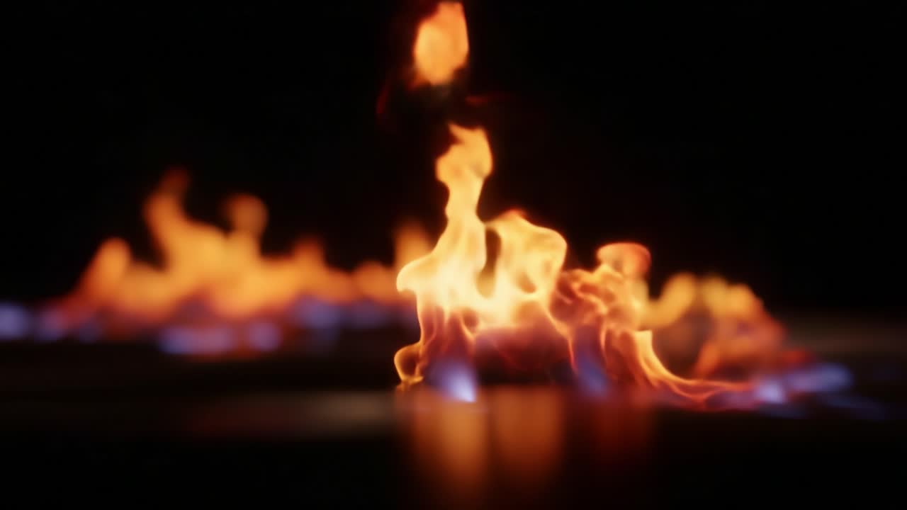 Captivating Flames Dance in Darkness: A Stunning Display of Colorful Fire Movements Against a Black Background, Evoking Warmth and Energy in the Shadows