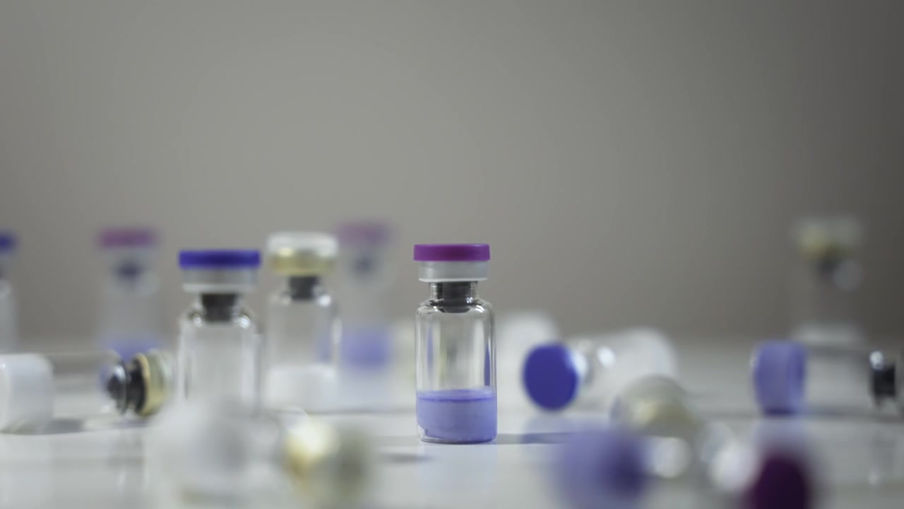 Pharmaceutical Vials with Colorful Caps, Dolly Right Shot [Peptide Concept]