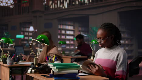 vertical video black girl reading books and handwritten class notes right before the exam