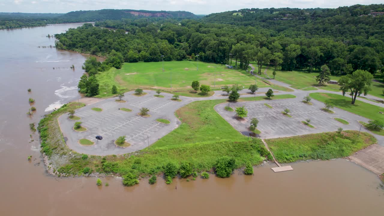 Aerial footage of Murray Park in Little Rock Arkansas. A parking lot and boat ramp are visible