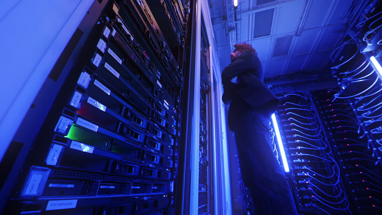 Man analysing servers in a data center