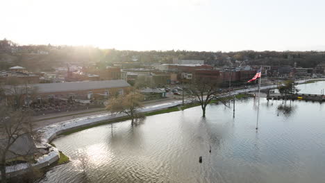 sandbag wall preventing city from flooding during overflowing river after spring natural disaster in america