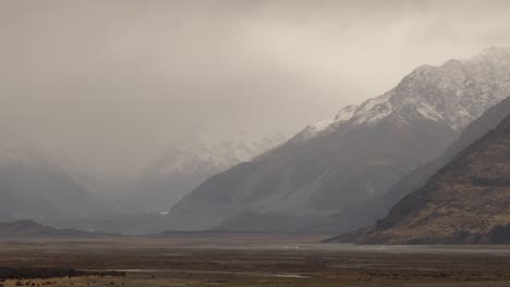 New-Zealand-autumn-season-landscape-with-mountains-during-rain,-with-cloud-moving-fast-in-the-mountains