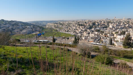 cars driving on outskirts of jerusalem, holy city in israel