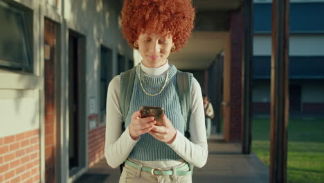 a woman with red hair using her cell phone