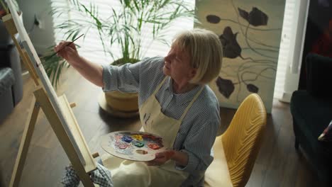 video of senior woman enjoying her hobby at her living room