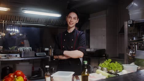 female chef in a busy restaurant kitchen